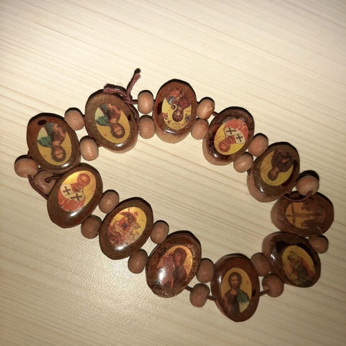 Bracelet with saint images like new with elastic cord