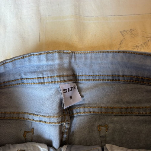 Dark blue skinny jeans with black lace and distressed details, size S, like new