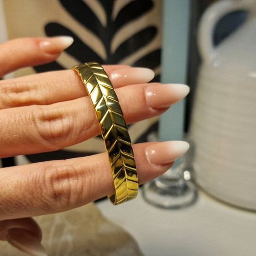 Cuff bracelet made of stainless steel new, gold color with embossed design