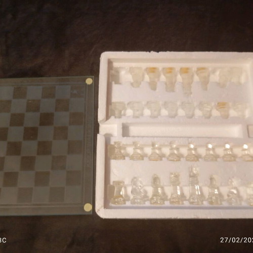 Glass chessboard used, missing one rook