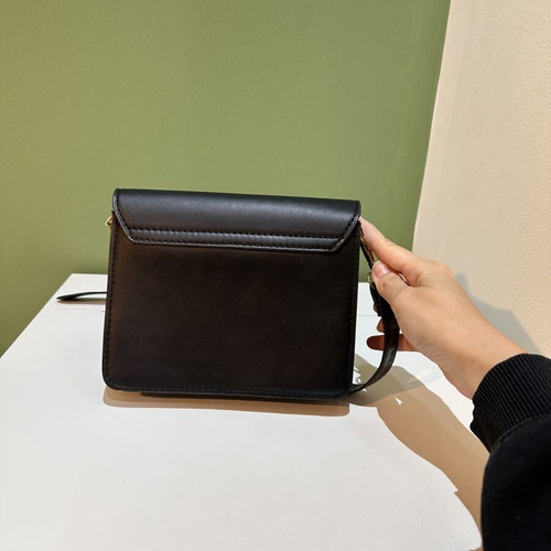 Black women's crossbody shoulder bag with gold details