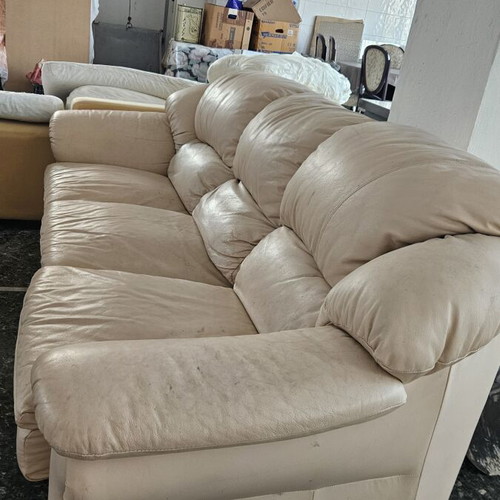 Leather three-seater sofa used, beige color