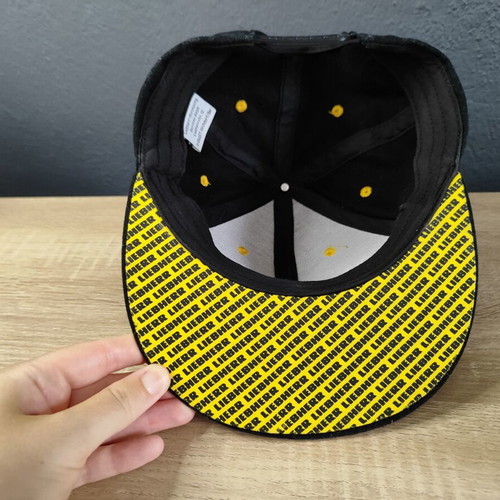 Liebherr Snapback Hat used, black and yellow