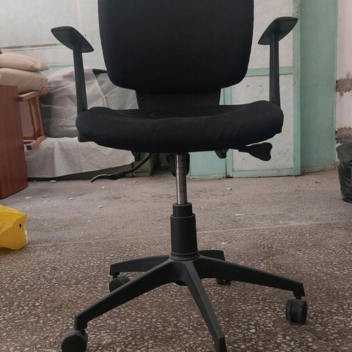 Black office chair used with wheels, seat cushion needs repair