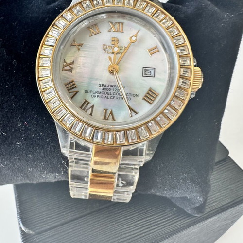 Watch with iridescent crystals like new, zircon and gold