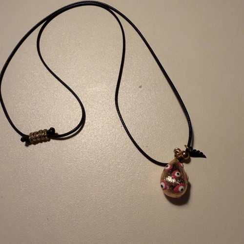 Easter egg pendant like new with leather cord