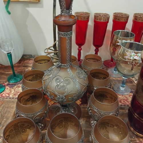 Cognac decanter set made of amber glass with metal decoration like new