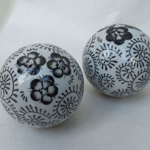 Vintage decorative porcelain spheres set like new with floral and geometric designs