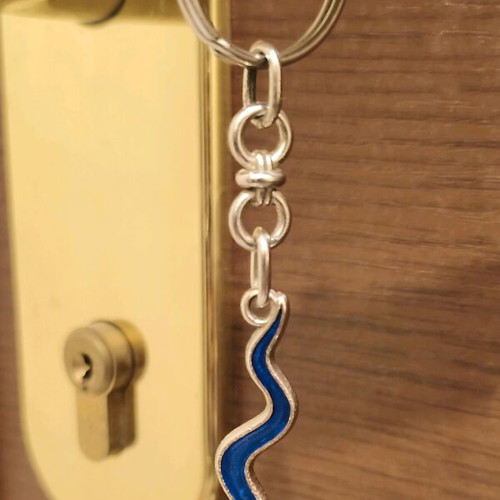 Drum keychain used, blue and silver, collectible souvenir