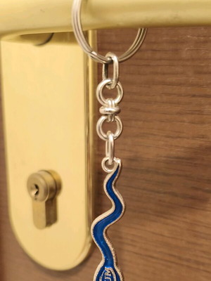 Drum keychain used, blue and silver, collectible souvenir