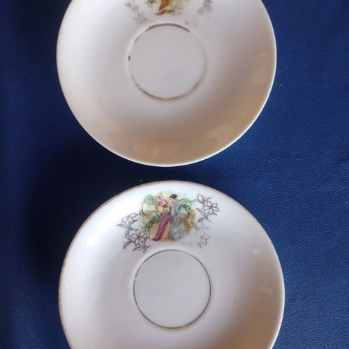 Porcelain vintage plates used, set of two with gold details