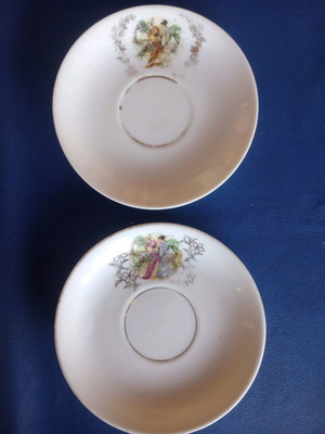 Porcelain vintage plates used, set of two with gold details