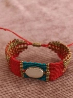 Macrame bracelet like new with gold-plated element and multicolor