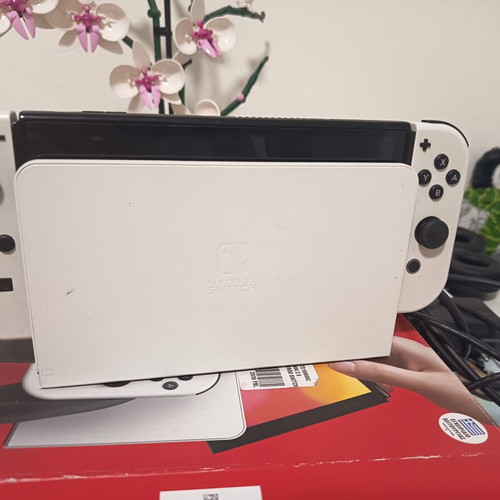 Nintendo Switch with three games