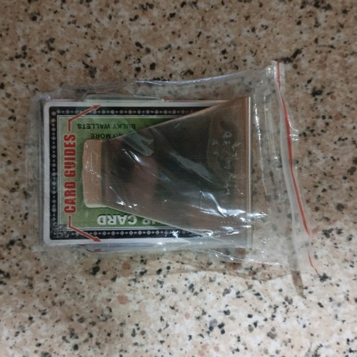 Metal cash and card holder used