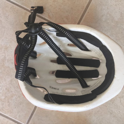 Pink bicycle helmet with flower and heart design