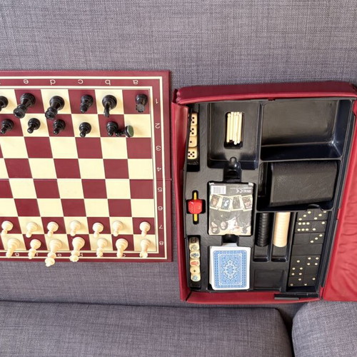 Vintage board games set used with chess, checkers, dominoes and cards