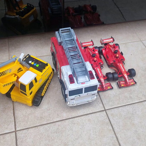 Toy cars used with working fire truck and bulldozer