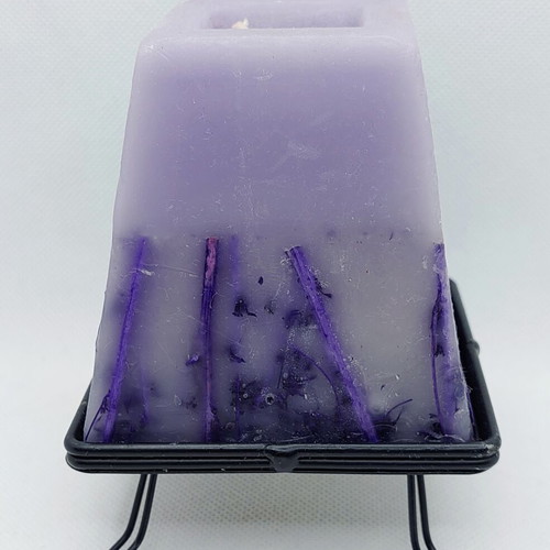 Decorative purple lavender candle with metal base