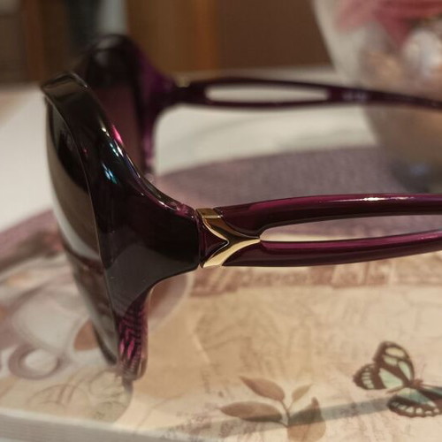 Women's oversized purple sunglasses with gold details