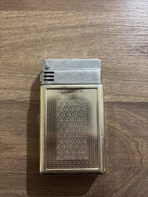 Sunflower lighter used with signs of wear, made in Shanghai