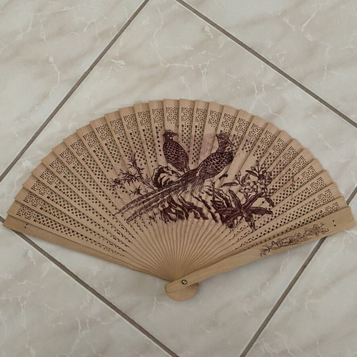 Vintage wooden hand fan used with bird designs