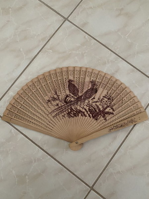 Vintage wooden hand fan used with bird designs