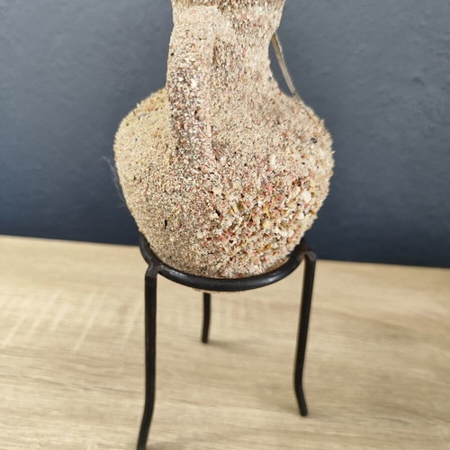 Handmade ceramic amphora decorative vase on metal base used