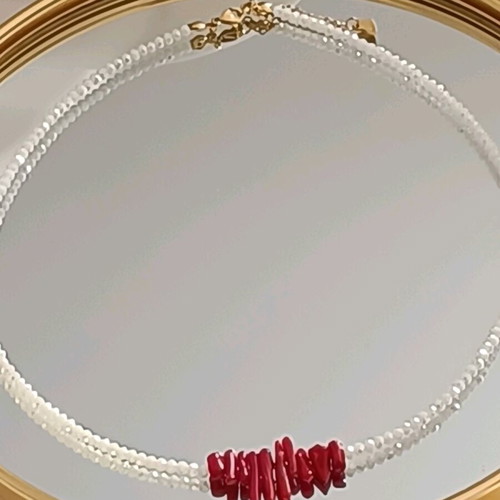 Handmade steel necklace with white crystals and red corals