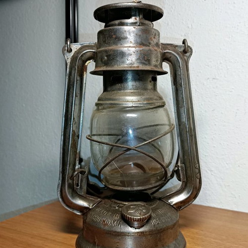 Vintage storm lantern used with cracked glass