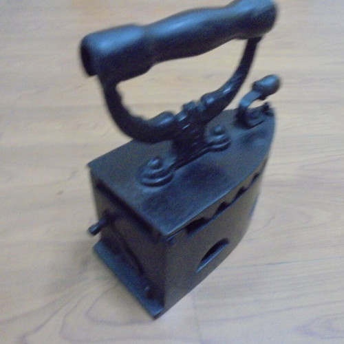 Antique charcoal iron restored with internal grill