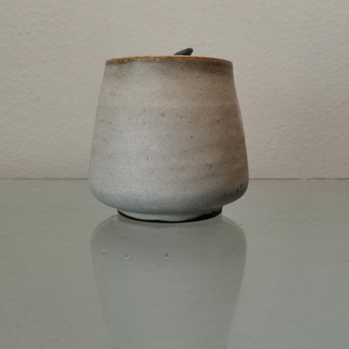 Clay handmade mug used with wavy handle