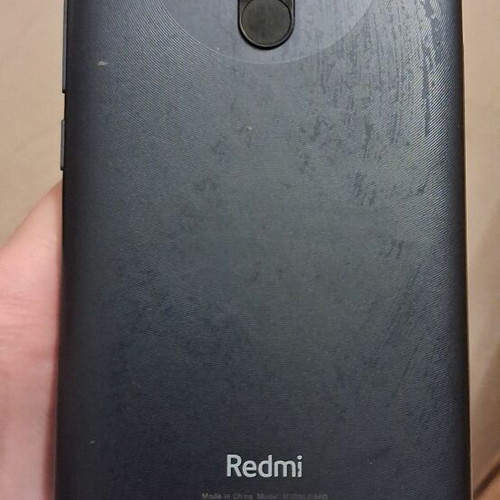 Xiaomi 9 smartphone with screen protector and case, gray