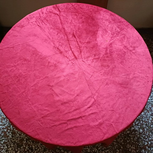Round table with red tablecloth used, vintage wood design
