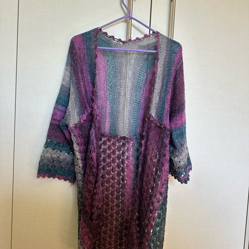 Knitted cardigan like new, multicolored with two patterns