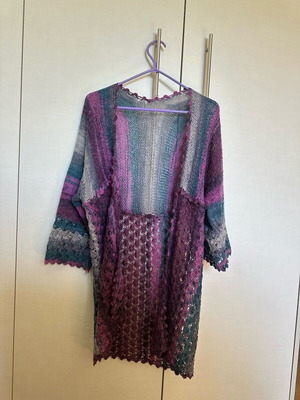 Knitted cardigan like new, multicolored with two patterns