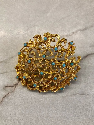 Vintage gold brooch with turquoise details like new