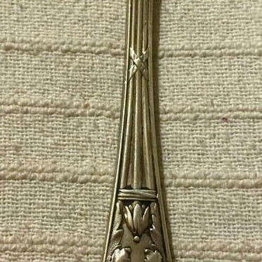 Vintage silver-plated food fork used with embossed decoration
