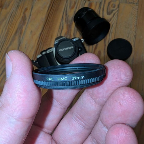 Olympus OM-D E-M10 camera with 2 prime lenses and accessories