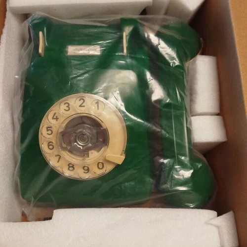 Old green wired telephone, functional