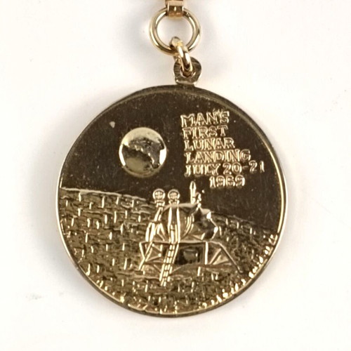 Apollo 11 collectible bronze medal and gold-plated keychain like new
