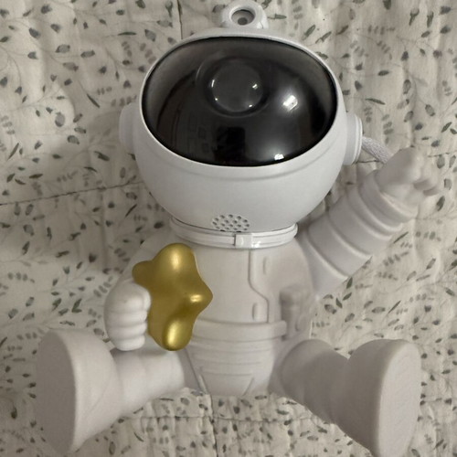 Astronaut night light with multicolor nebula projection