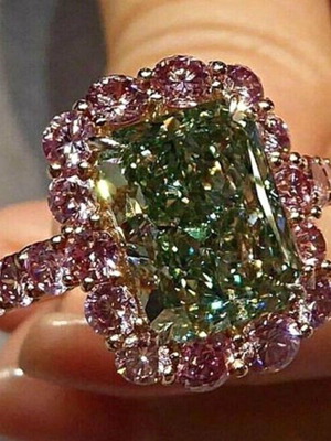 Ring new with cubic zirconia, red and green stones