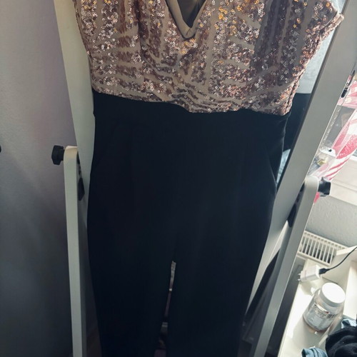 One-piece jumpsuit used, pink sequin top, flared pants, size S-M
