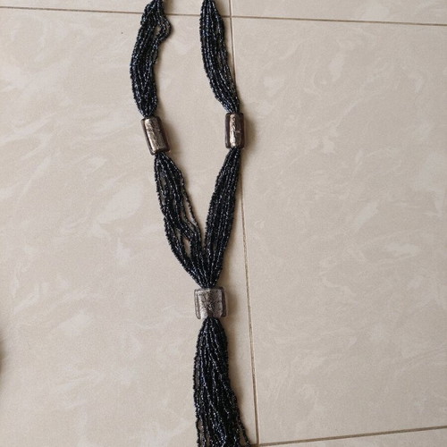 Necklace new with thin black beads and gray transparent stones