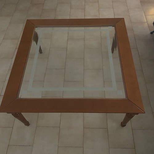Coffee table with glass top and wooden base