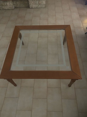 Coffee table with glass top and wooden base