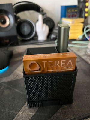 Icos holder with built-in ashtray