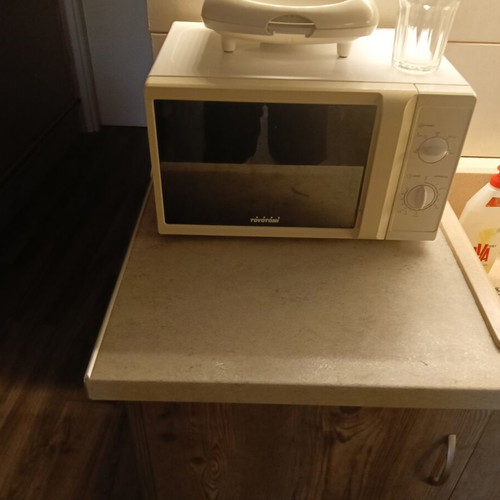 Sofa set with storage, kitchen, and microwave oven like new