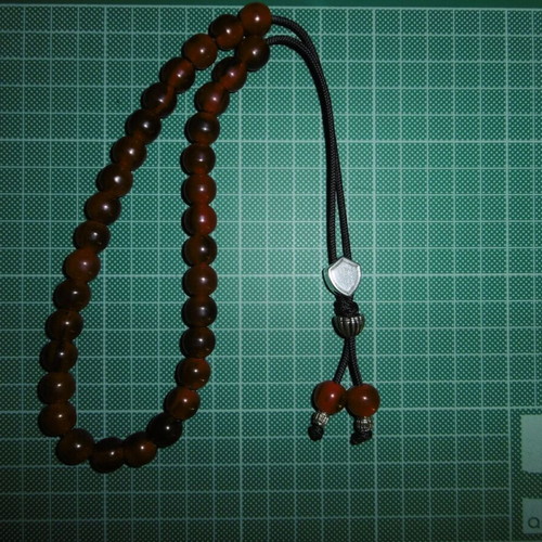 Handmade worry beads with 33+2 red acrylic beads, silver shield